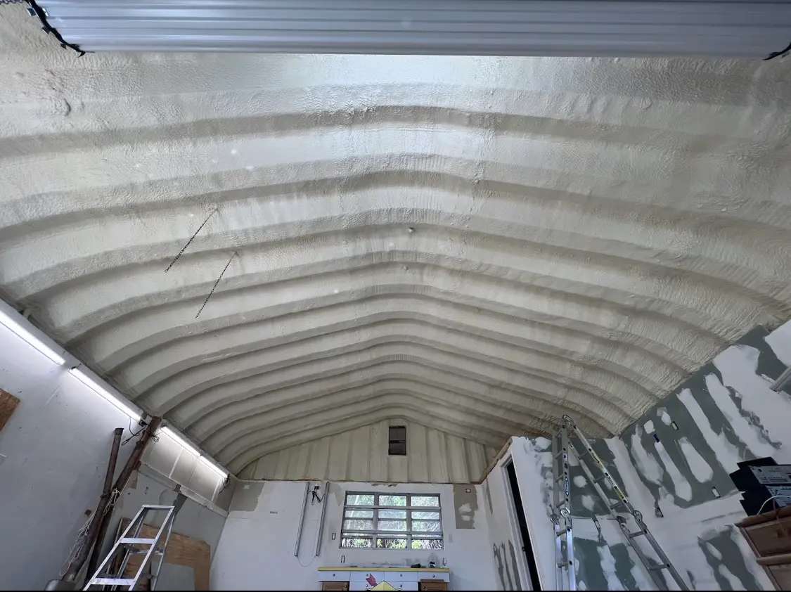 Spray polyurethane foam applied to the underside of a metal roof deck in Nacogdoches